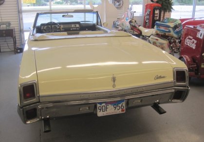 A sporty 1967 Oldsmobile Cutlass convertible at Boondock's in wood, . A very nicely dressed up car!